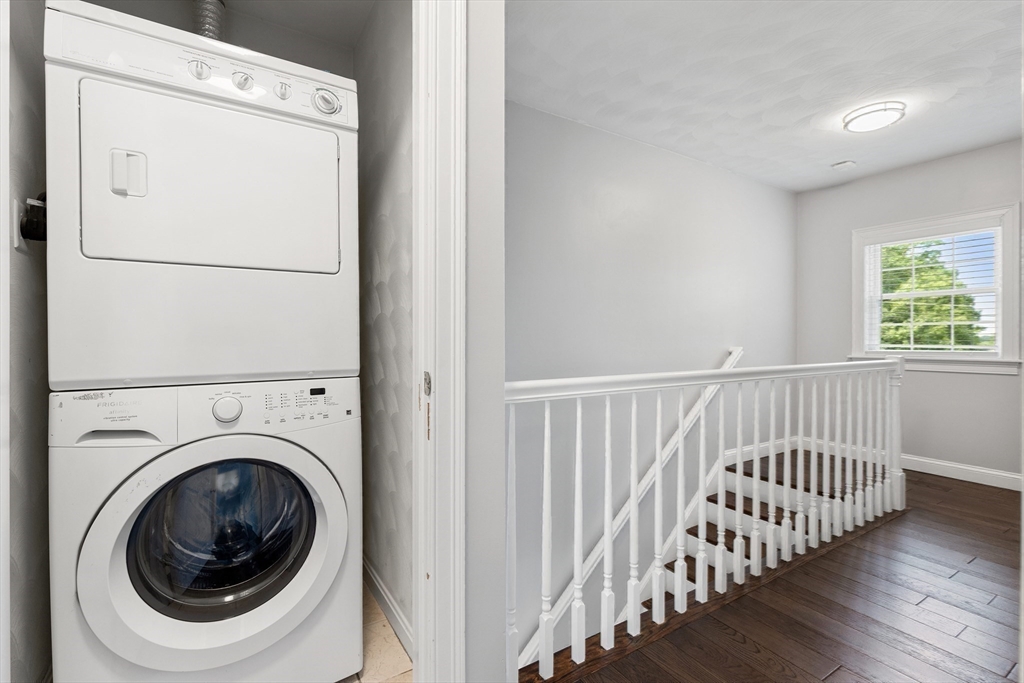 2 Ricciuti Drive, Unit 9 Quincy, MA 02169 - Photo 20 of 40 a view of a hallway with washer and dryer