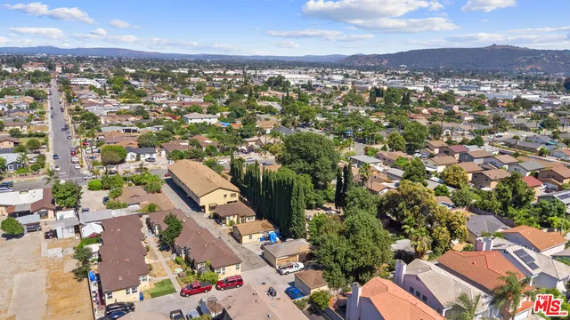 an aerial view of residential houses with outdoor space