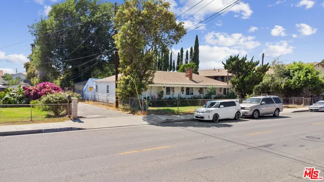 a view of street with parked cars