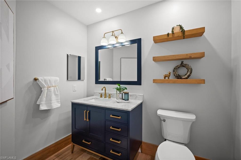 2012 Prince Drive Naples, FL 34110 - Photo 21 of 41 a bathroom with a toilet sink and mirror