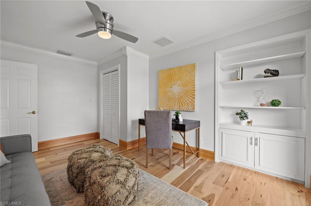 2012 Prince Drive Naples, FL 34110 - Photo 23 of 41 a bedroom with a bed and a table in it