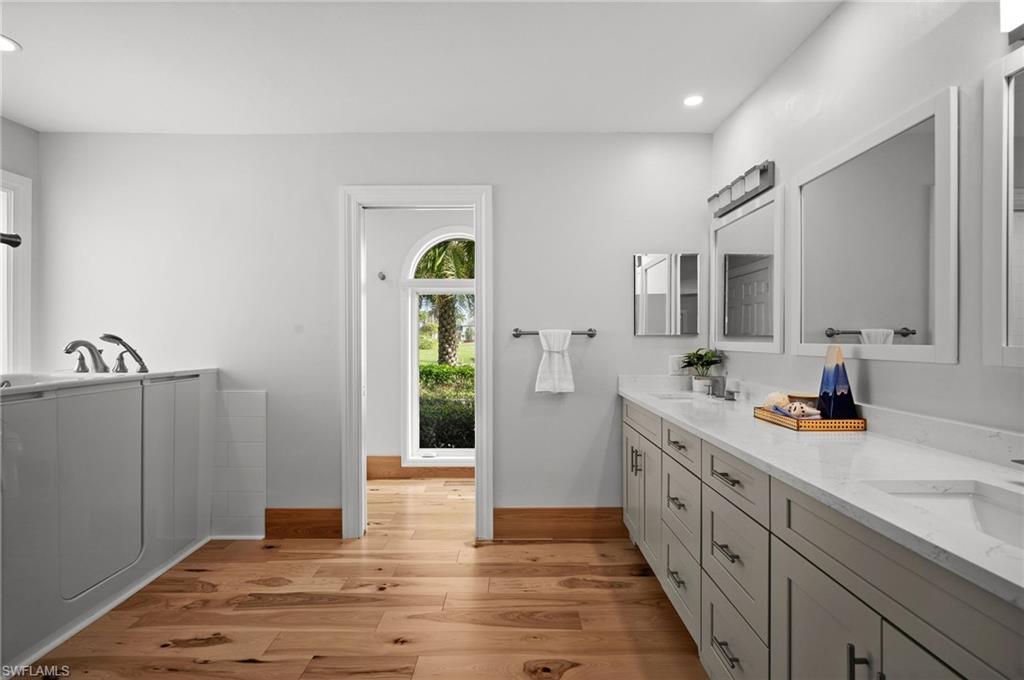 2012 Prince Drive Naples, FL 34110 - Photo 26 of 41 a bathroom with a sink and mirror