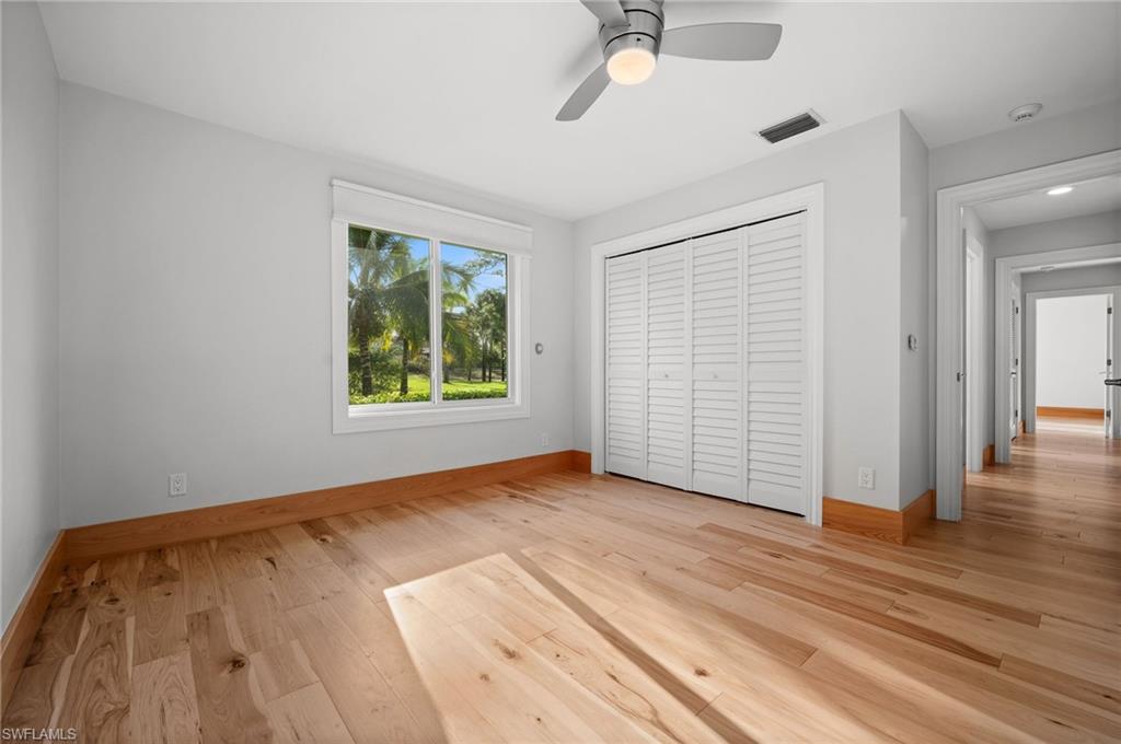 2012 Prince Drive Naples, FL 34110 - Photo 30 of 41 wooden floor in an empty room with a window