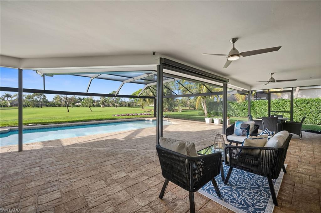 2012 Prince Drive Naples, FL 34110 - Photo 34 of 41 a living room with furniture and a yard