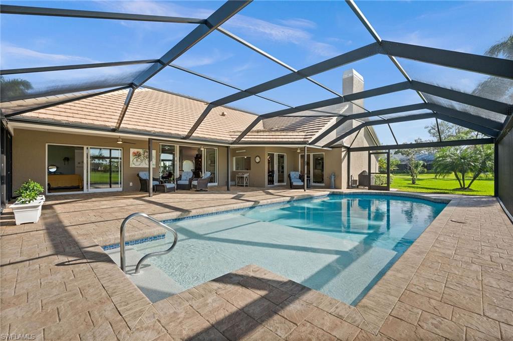 2012 Prince Drive Naples, FL 34110 - Photo 35 of 41 a view of a swimming pool with sitting area