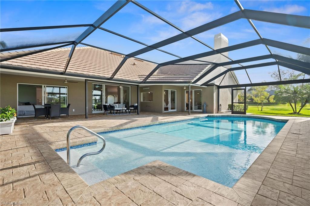 2012 Prince Drive Naples, FL 34110 - Photo 36 of 41 a view of a swimming pool with a patio