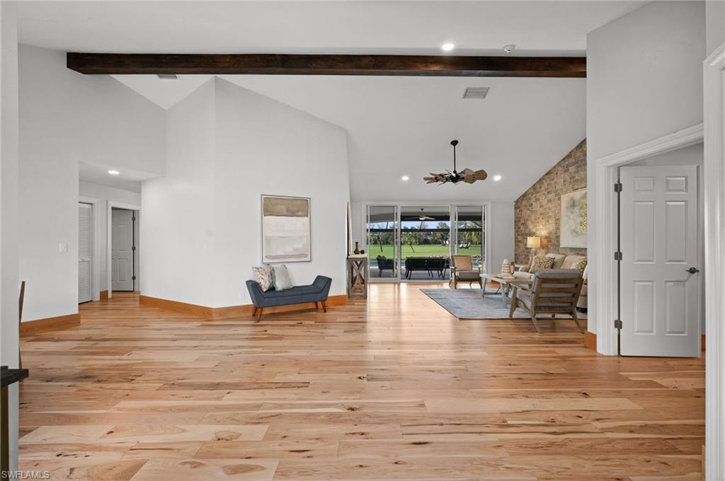 2012 Prince Drive Naples, FL 34110 - Photo 4 of 41 a living room with fireplace furniture and a large window