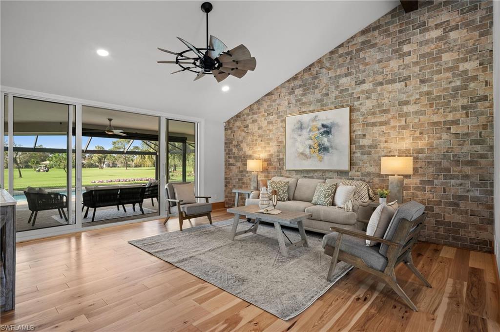 2012 Prince Drive Naples, FL 34110 - Photo 5 of 41 a living room with furniture a large window with kitchen view