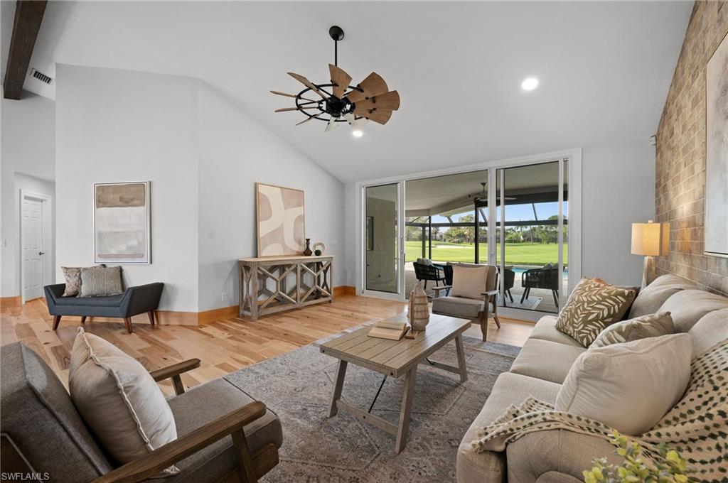 2012 Prince Drive Naples, FL 34110 - Photo 6 of 41 a living room with furniture and a large window