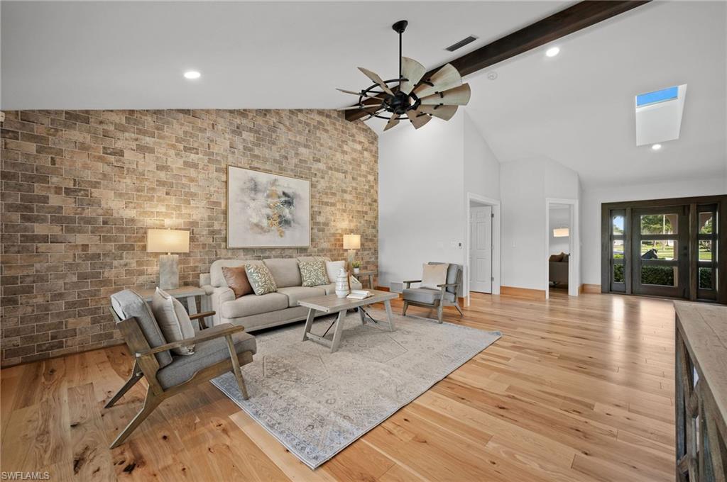 2012 Prince Drive Naples, FL 34110 - Photo 7 of 41 a living room with furniture and wooden floor
