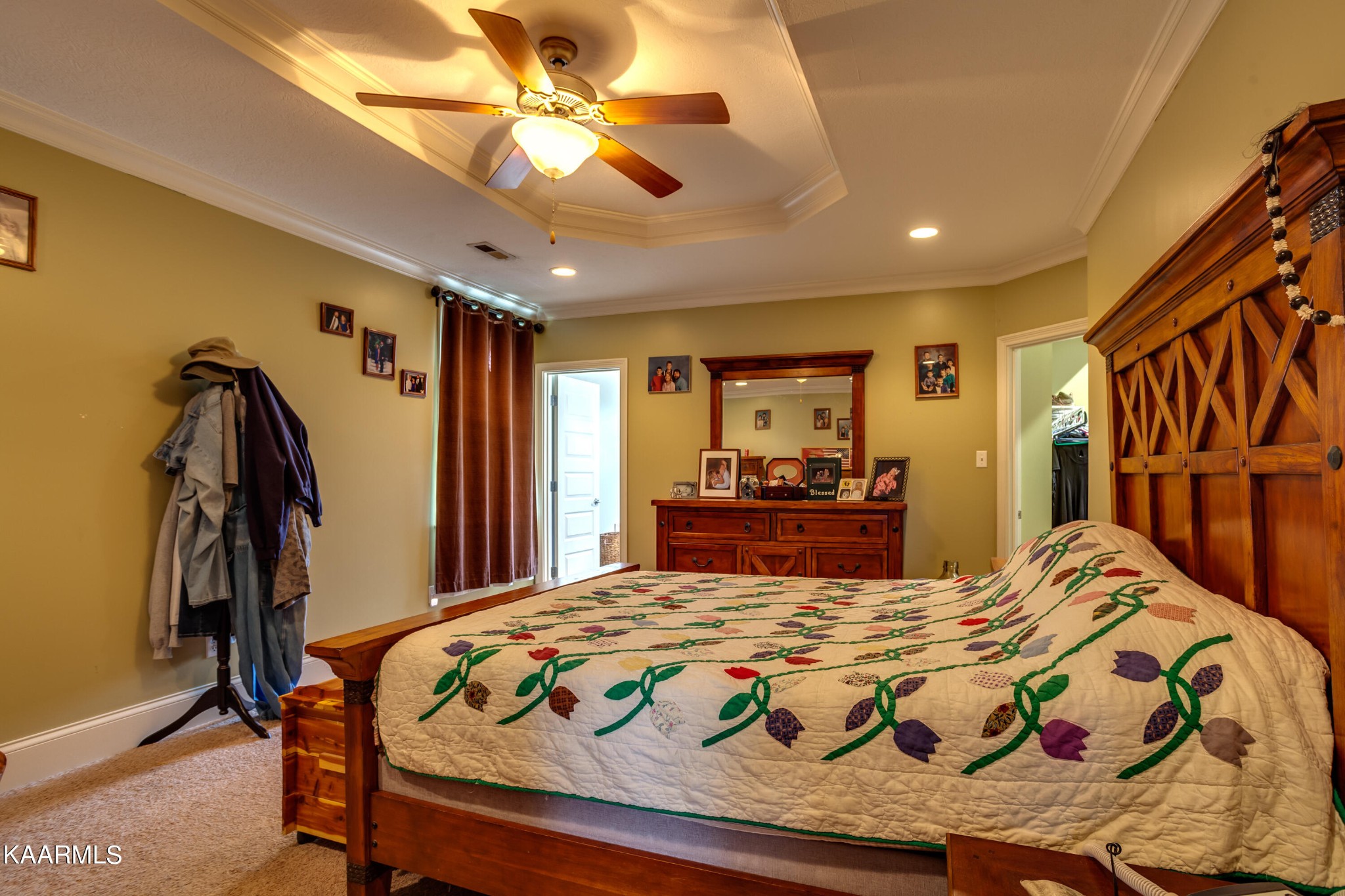 9601 Captain Smith Lane Corryton, TN 37721 - Photo 18 of 40 a bedroom with a bed and a chandelier