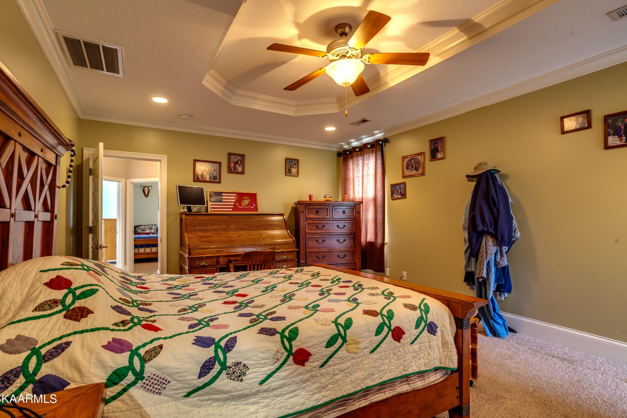 9601 Captain Smith Lane Corryton, TN 37721 - Photo 19 of 40 a bedroom with a bed and a chandelier