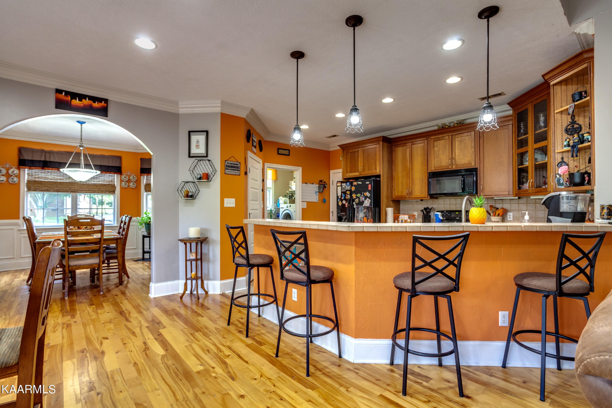 9601 Captain Smith Lane Corryton, TN 37721 - Photo 9 of 40 a kitchen with stainless steel appliances kitchen island granite countertop a table chairs and a refrigerator