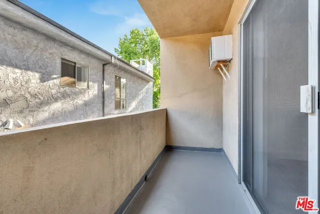 a view of a balcony with a street