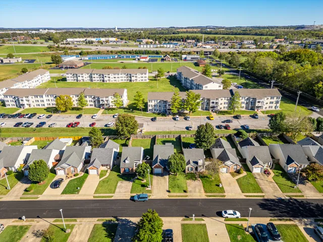 an aerial view of residential houses and outdoor space