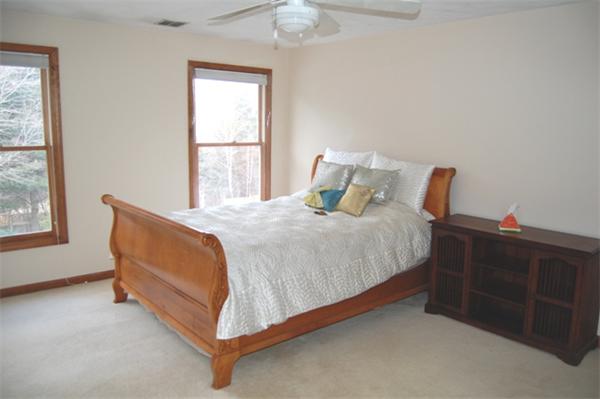155 East Emerson Road Lexington, MA 02420 - Photo 15 of 18 a bed sitting in a bedroom next to a window