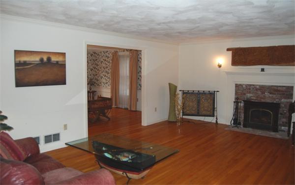 155 East Emerson Road Lexington, MA 02420 - Photo 5 of 18 a living room with furniture and a fireplace