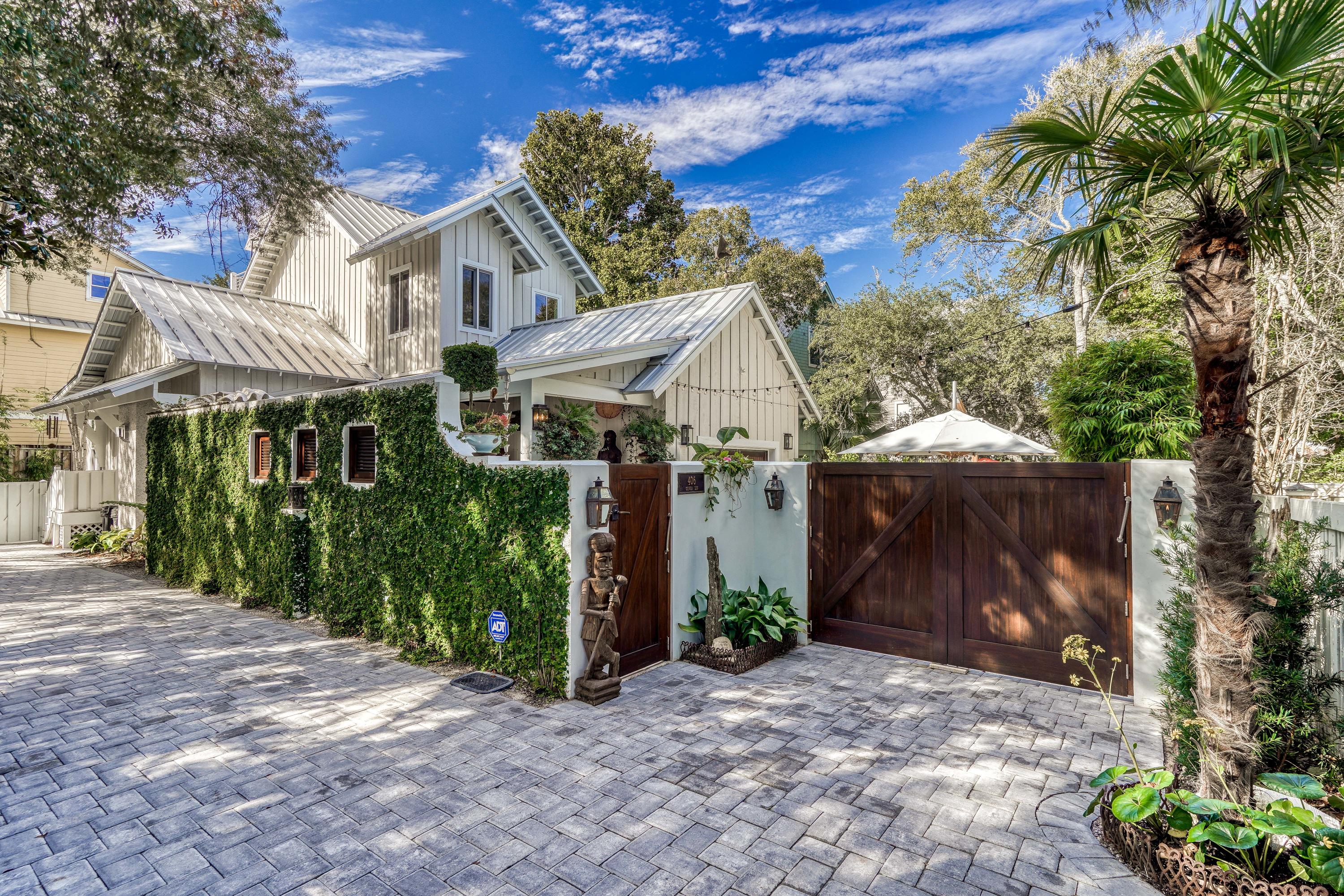 406 Defuniak Street Santa Rosa Beach, FL 32459 - Photo 1 of 87 a view of a house with a yard and tree s