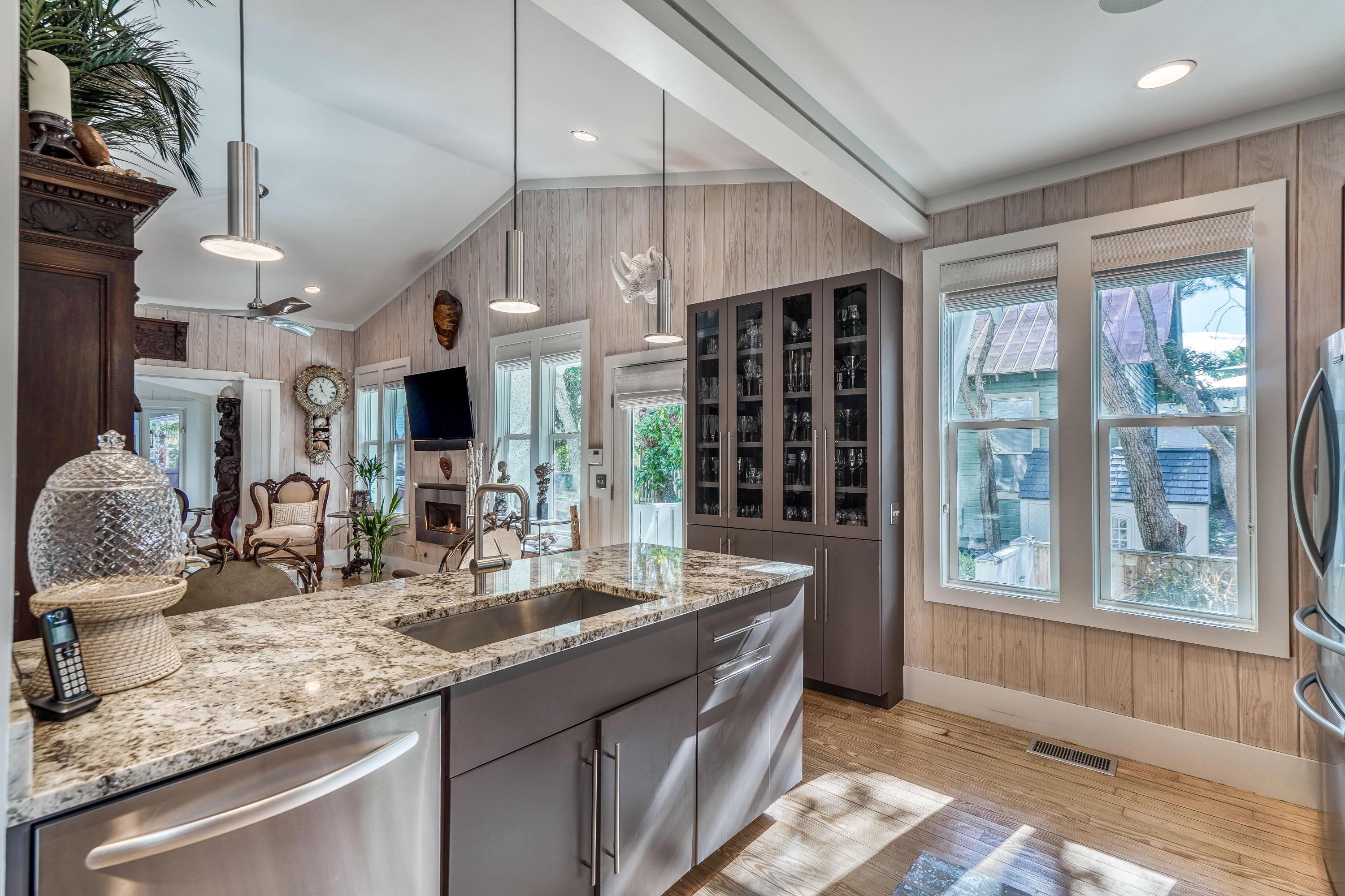406 Defuniak Street Santa Rosa Beach, FL 32459 - Photo 11 of 87 a kitchen with stainless steel appliances granite countertop a sink and a large window