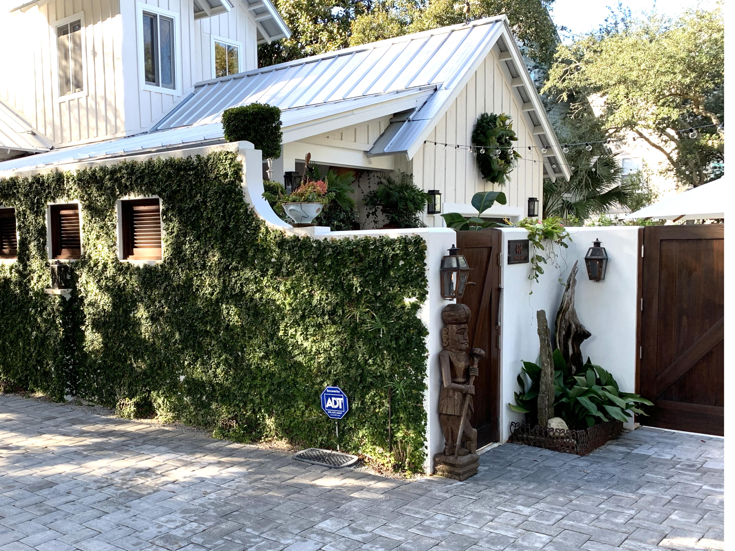 406 Defuniak Street Santa Rosa Beach, FL 32459 - Photo 2 of 87 a front view of a house with garden
