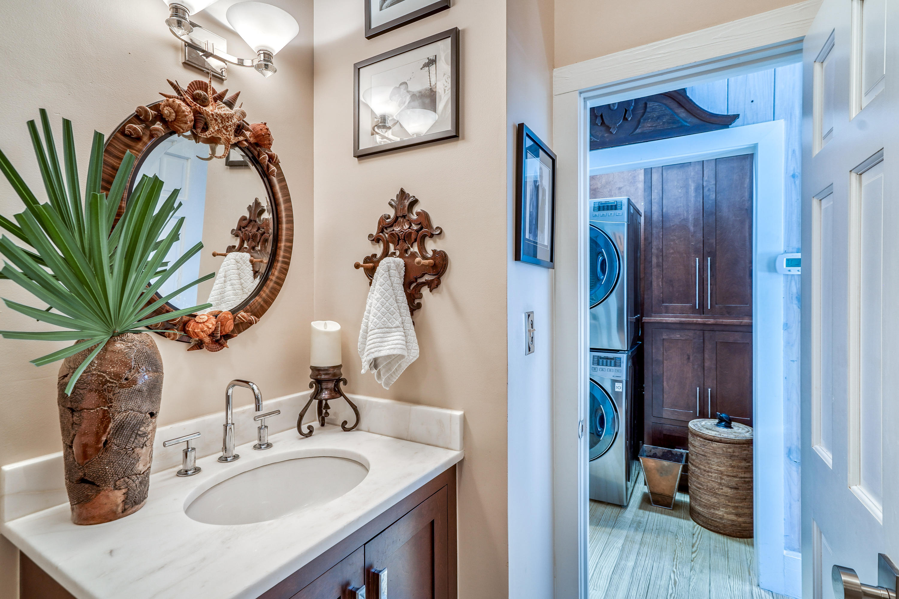406 Defuniak Street Santa Rosa Beach, FL 32459 - Photo 22 of 87 a bathroom with a sink and a mirror