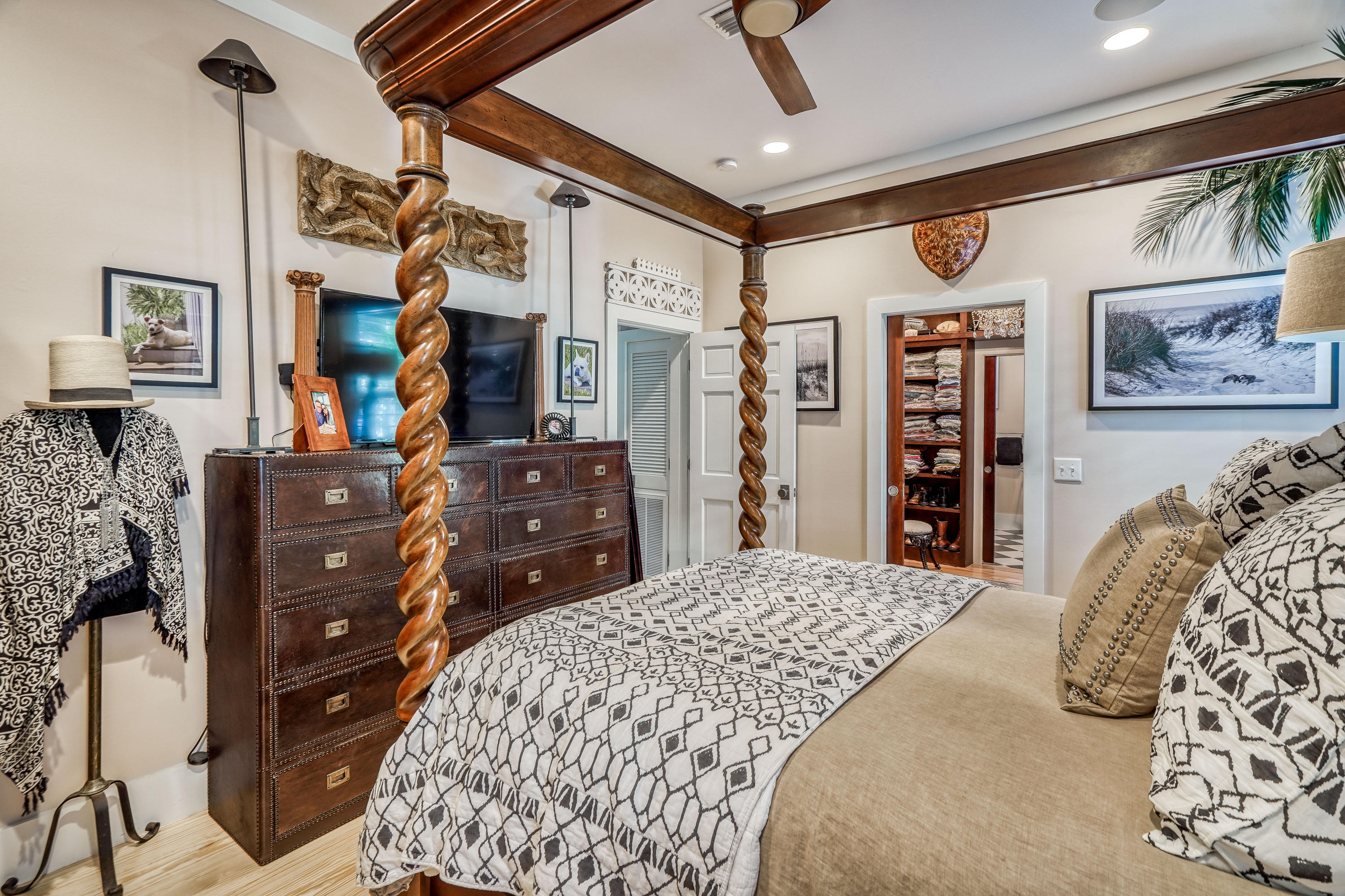 406 Defuniak Street Santa Rosa Beach, FL 32459 - Photo 25 of 87 a bedroom with a bed a dresser and a walk in closet