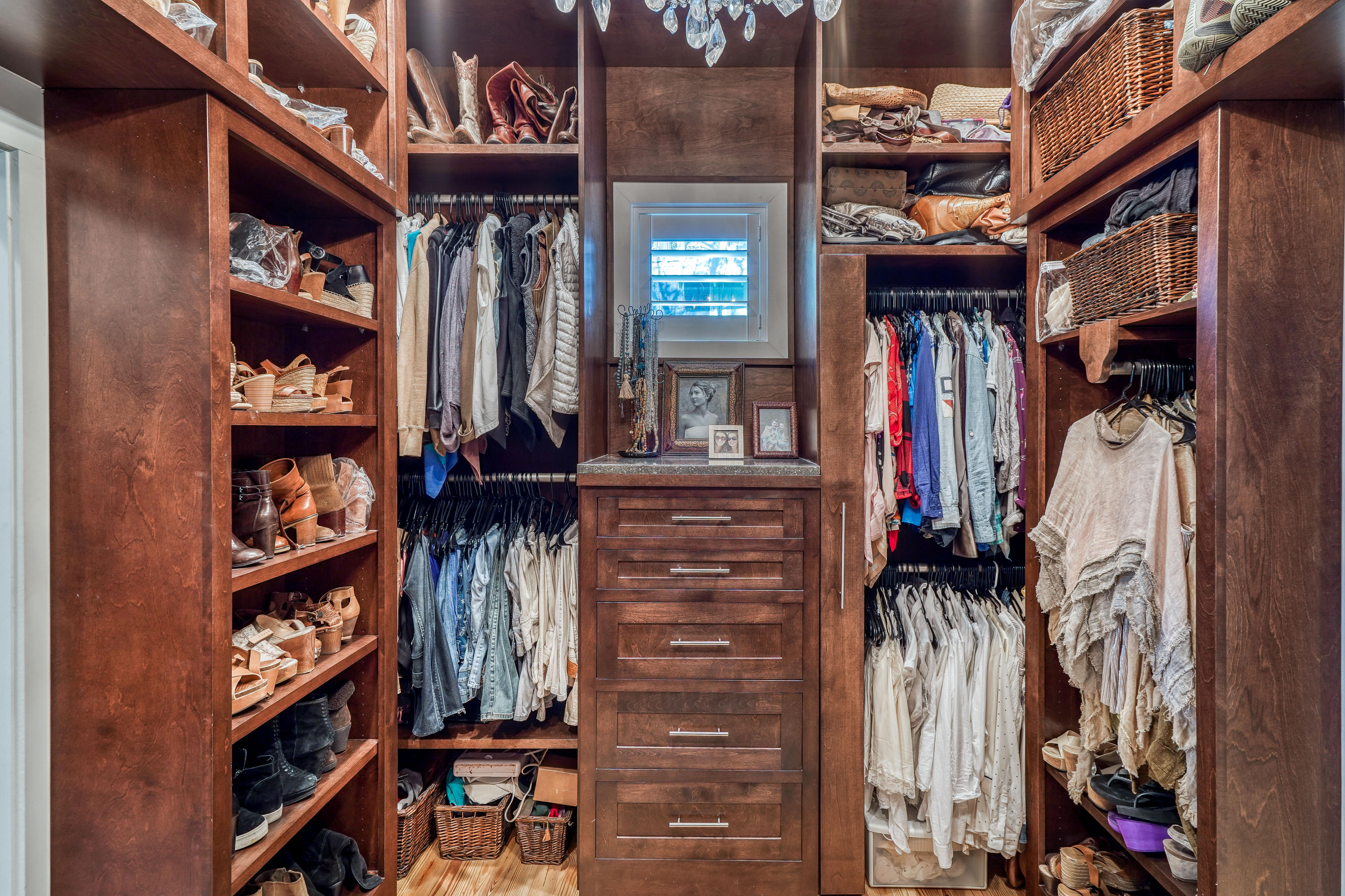 406 Defuniak Street Santa Rosa Beach, FL 32459 - Photo 29 of 87 a view of walk in closet with clothes and shoes