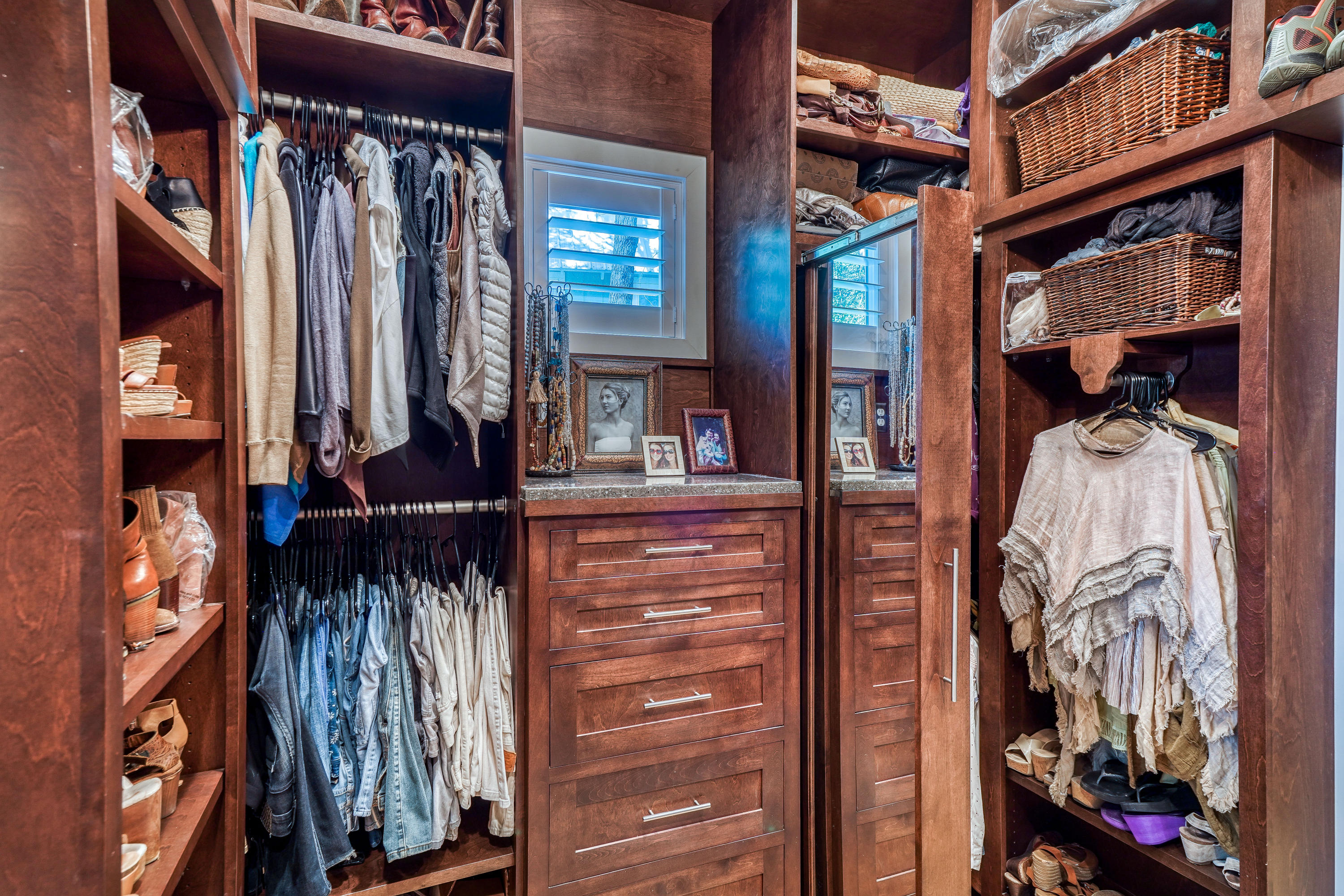 406 Defuniak Street Santa Rosa Beach, FL 32459 - Photo 32 of 87 a view of walk in closet with clothes and shoes