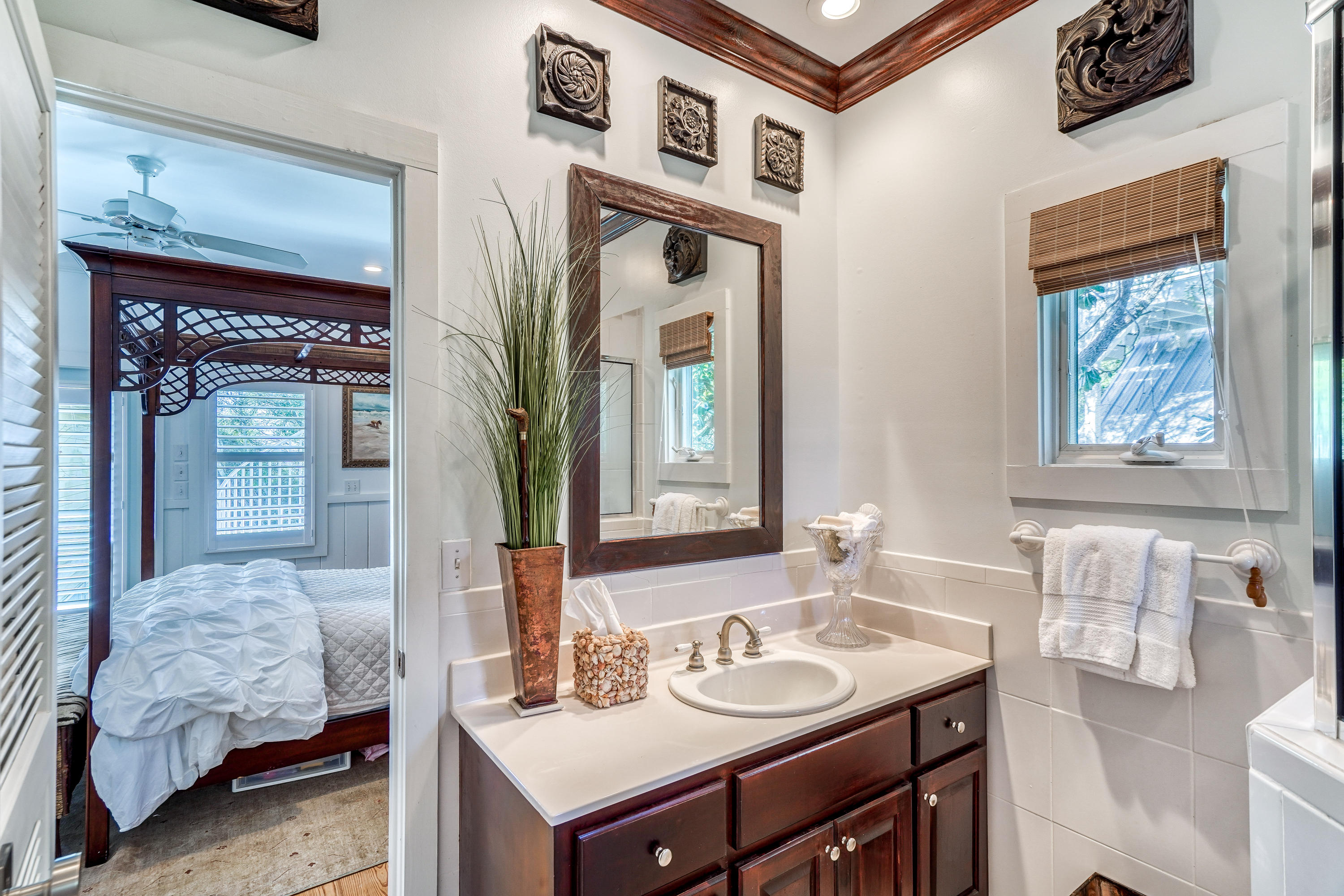 406 Defuniak Street Santa Rosa Beach, FL 32459 - Photo 42 of 87 a en suite bathroom with a sink and a mirror