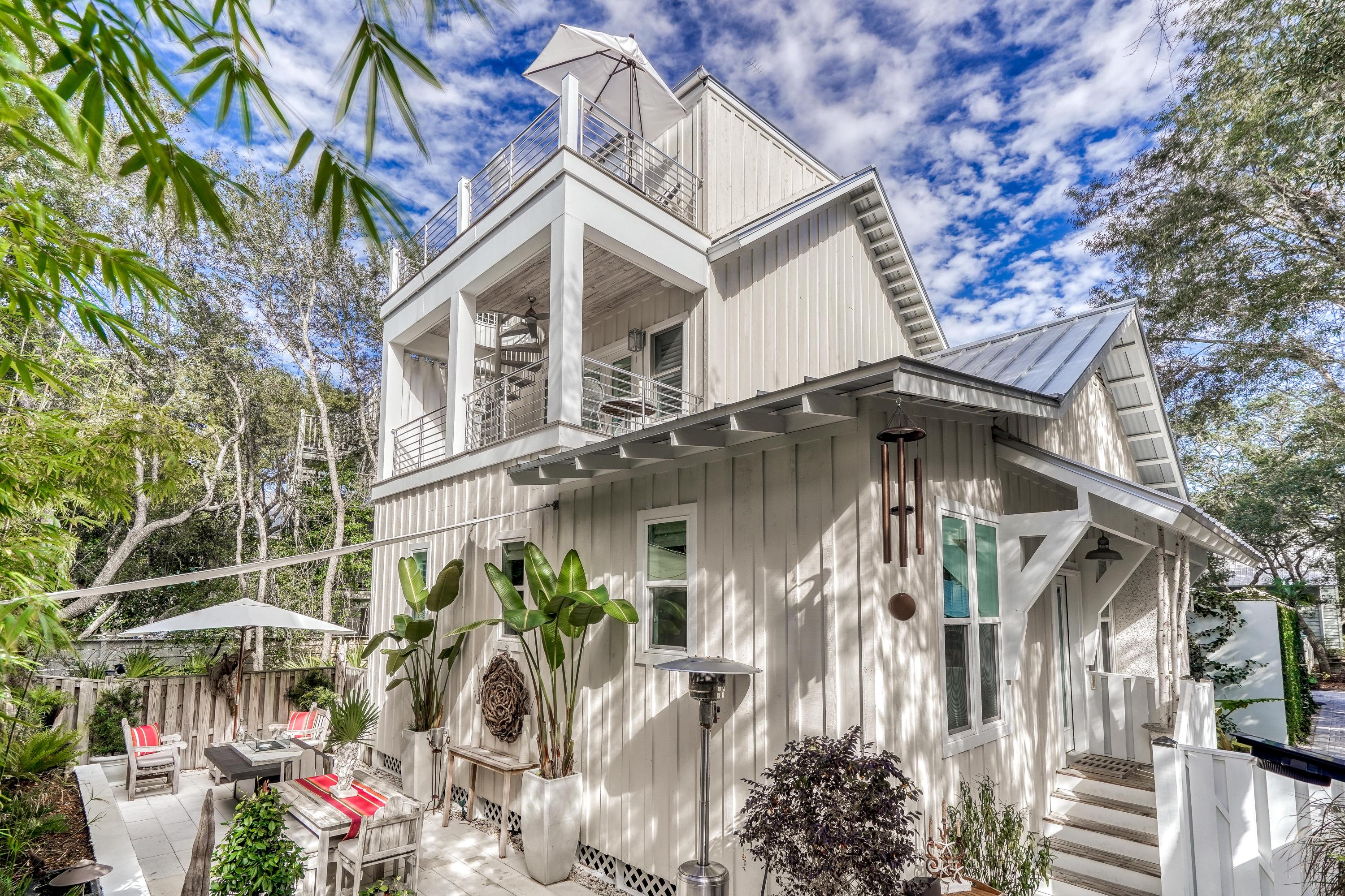 406 Defuniak Street Santa Rosa Beach, FL 32459 - Photo 5 of 87 a front view of a house with a yard