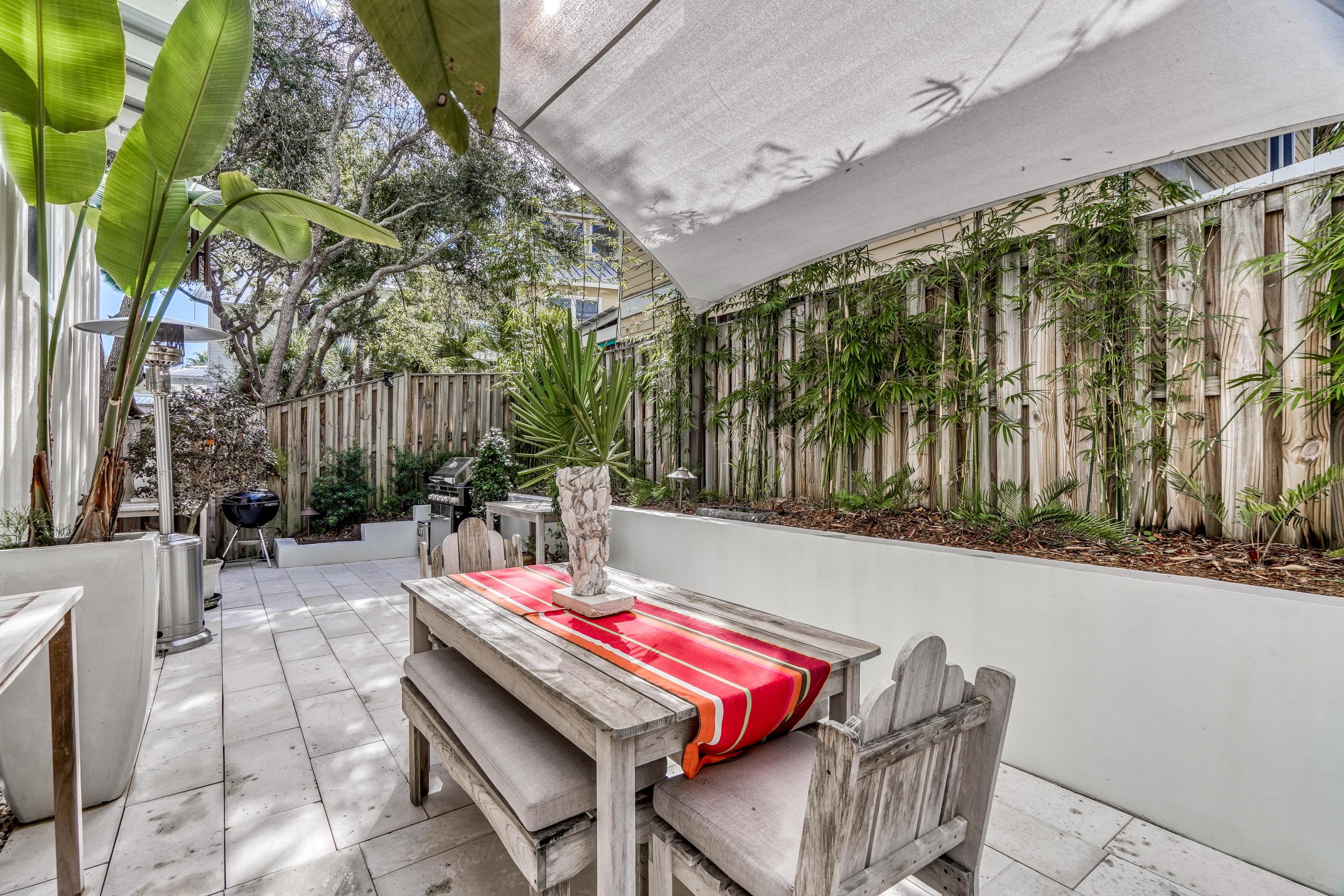 406 Defuniak Street Santa Rosa Beach, FL 32459 - Photo 56 of 87 a outdoor space with lots of furniture and garden view