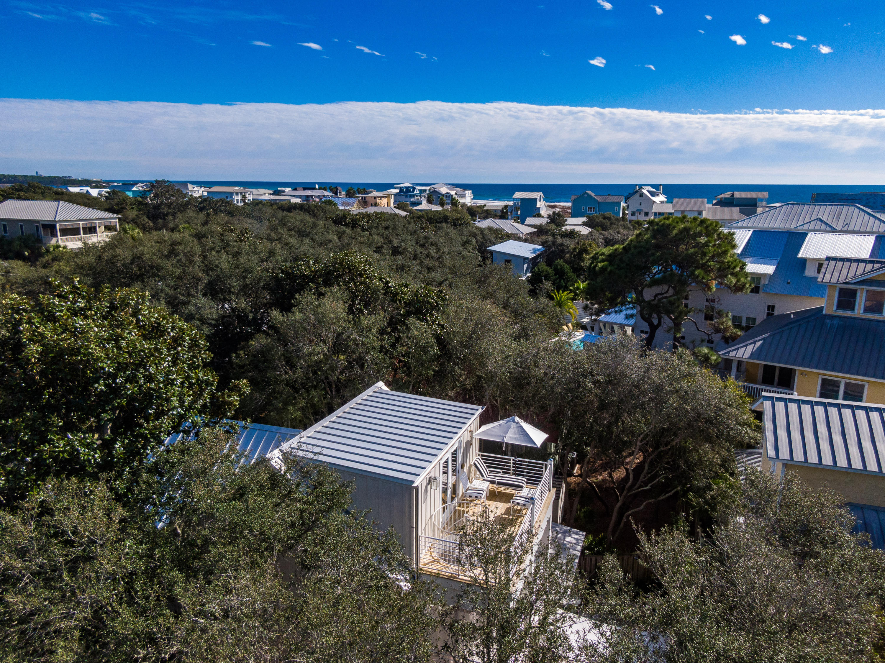 406 Defuniak Street Santa Rosa Beach, FL 32459 - Photo 82 of 87 an aerial view of a house with a yard and lake view