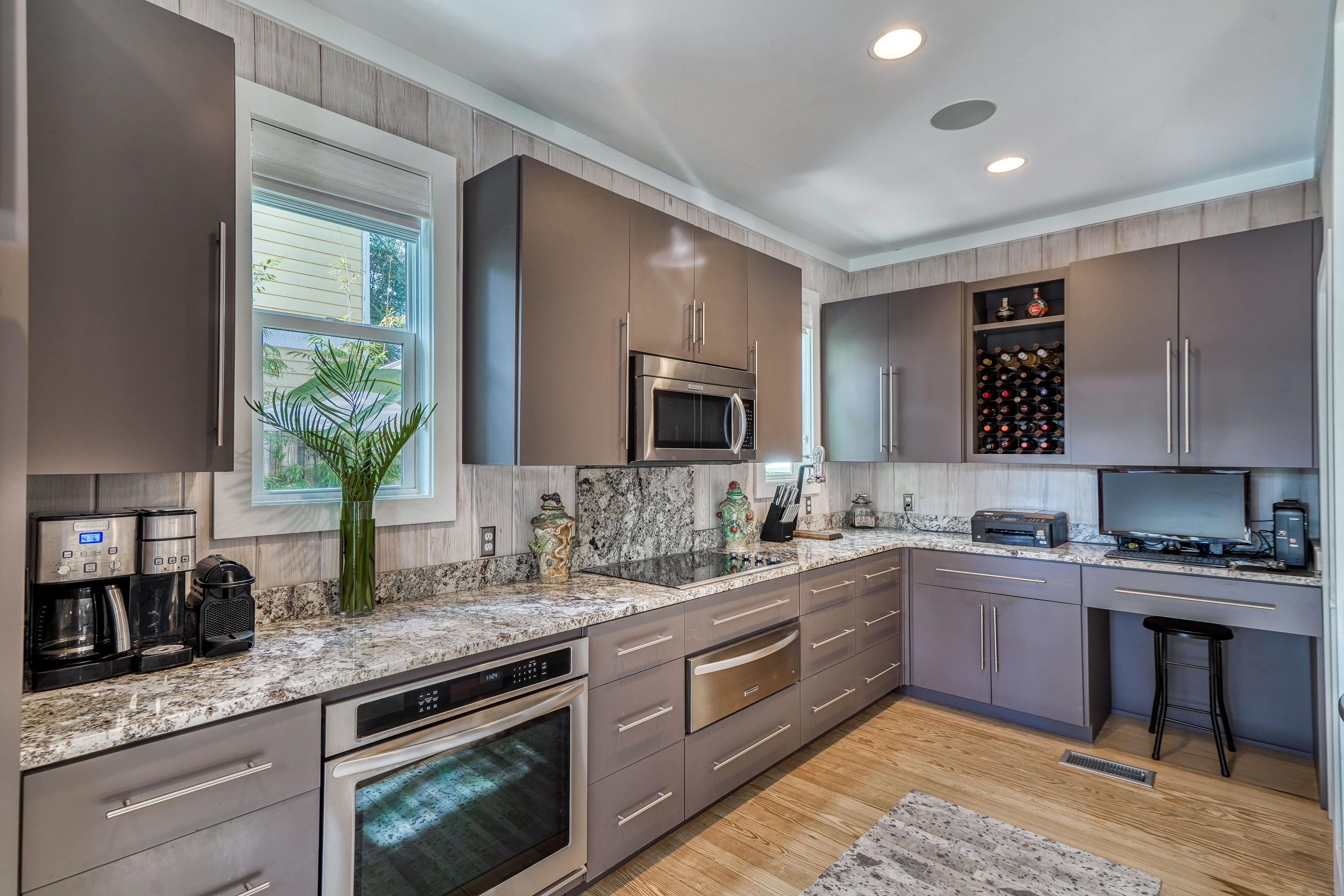 406 Defuniak Street Santa Rosa Beach, FL 32459 - Photo 10 of 87 a kitchen with a sink stove and microwave