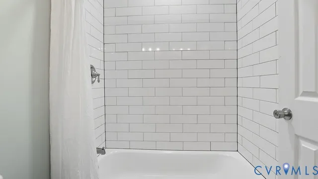 a bedroom with bed and a potted plant