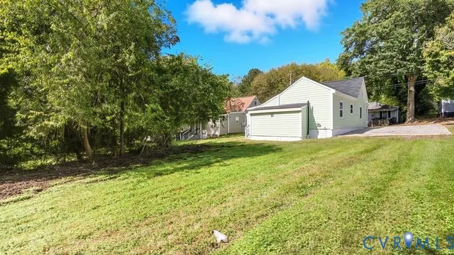 a view of a yard with swimming pool