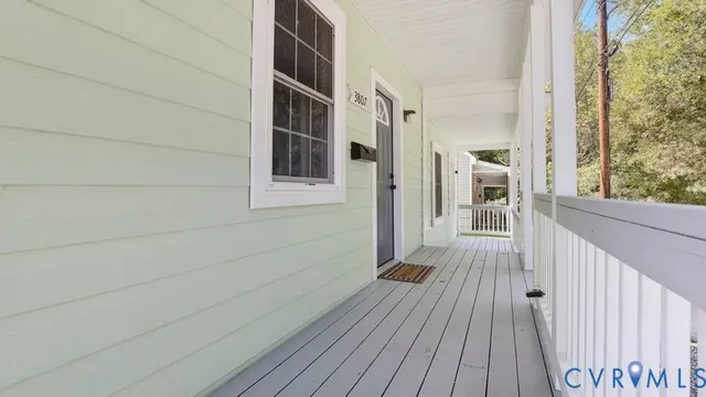 a view of wooden floor and a bathroom