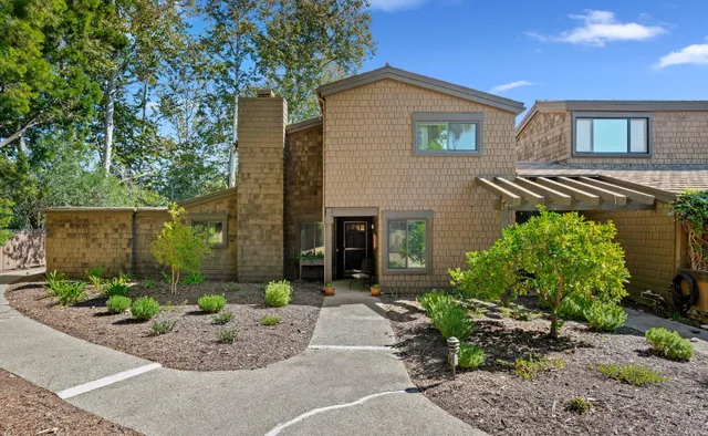 a front view of a house with garden