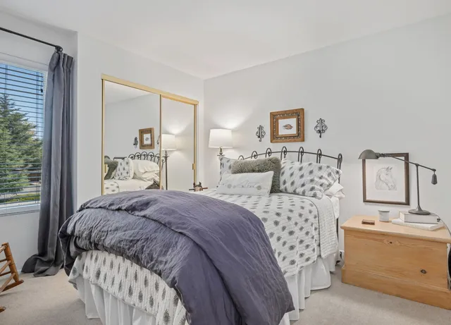 a view of a porch with chairs and potted plants