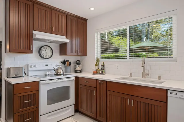 a kitchen with lots of counter top space and dining table