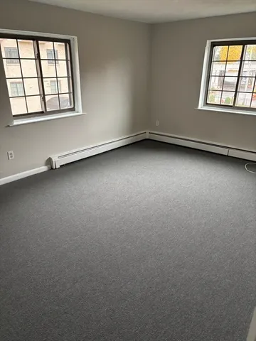 a view of swimming pool with a bench