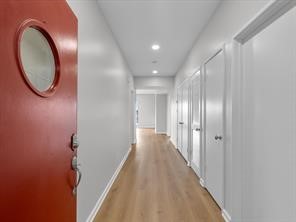 1302 Marina Bay Drive, Unit 201A Kemah, TX 77565 - Photo 11 of 43 a view of a hallway with wooden floor