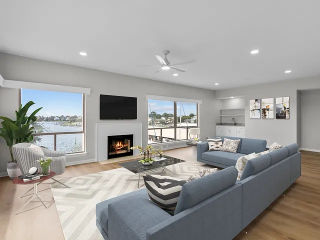 a living room with fireplace furniture and a fireplace