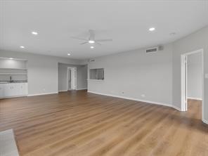 1302 Marina Bay Drive, Unit 201A Kemah, TX 77565 - Photo 16 of 43 a view of empty room with wooden floor