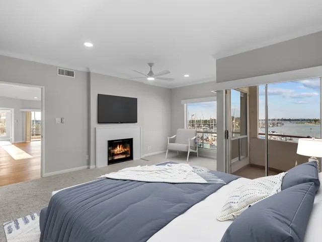 a bedroom with furniture and a fireplace