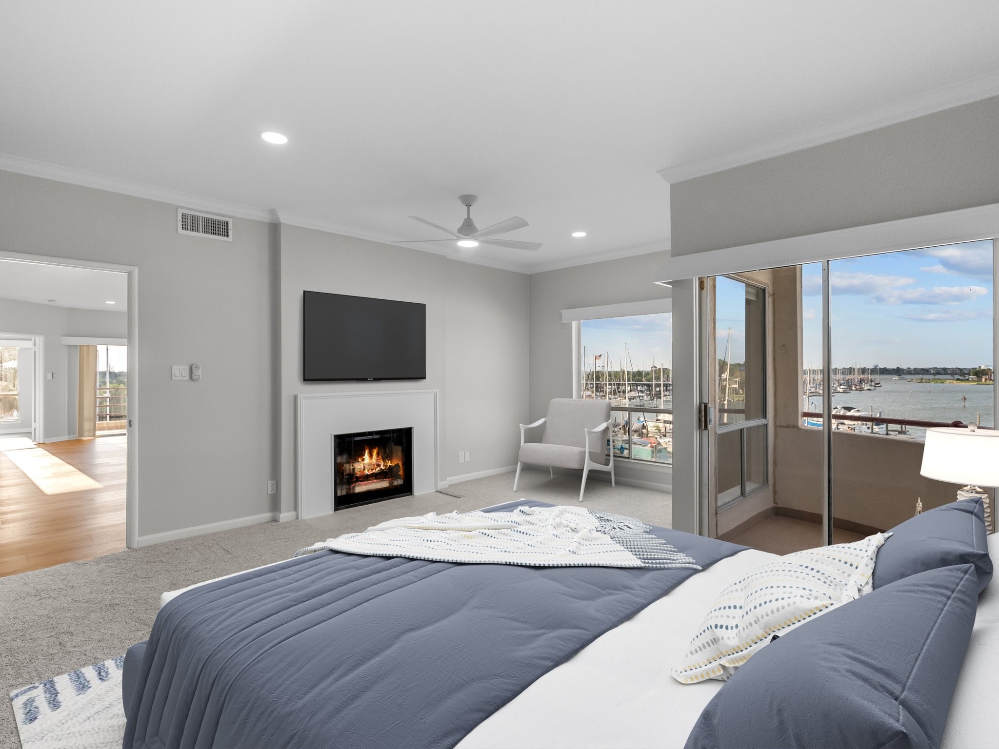 1302 Marina Bay Drive, Unit 201A Kemah, TX 77565 - Photo 28 of 43 a bedroom with furniture and a fireplace