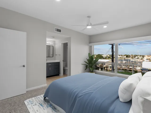a bedroom with a bed closet and wooden floor