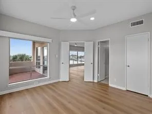 a view of livingroom with hardwood floor and a ceiling fan