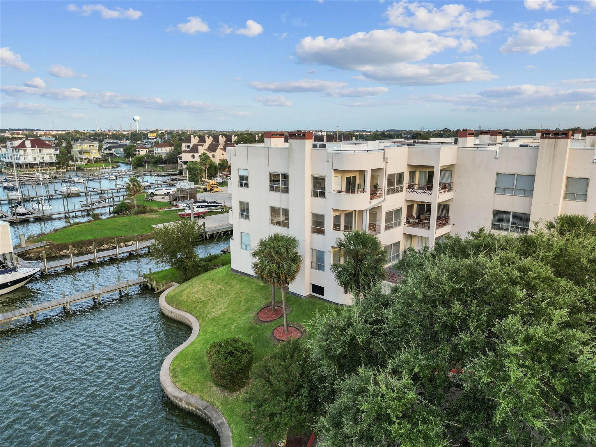 1302 Marina Bay Drive, Unit 201A Kemah, TX 77565 - Photo 4 of 43 aerial view of a house with a yard