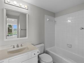 1302 Marina Bay Drive, Unit 201A Kemah, TX 77565 - Photo 41 of 43 a bathroom with a sink toilet and shower