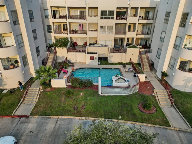 a view of a house with backyard porch and sitting area